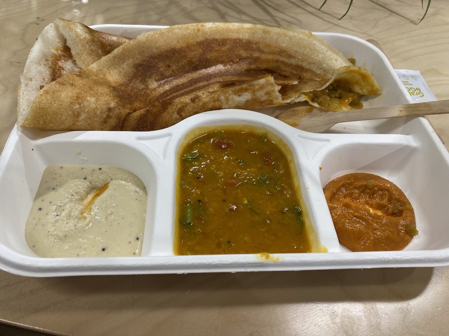 A crisp golden masala dosa served with sambar, coconut chutney and tomato chutney at Madurai Masala Dosa Kadai, Ilford